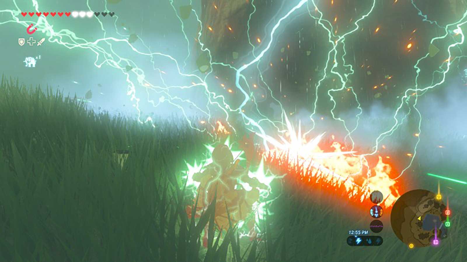 Link a few feet from a lightning strike that immediately causes a fire in the grass